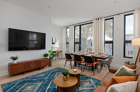 a living room with a table and chairs